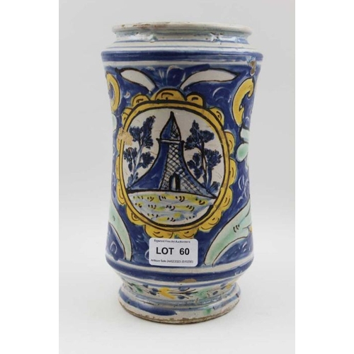 60 - A majolica wet drug jar, hand painted floral, and architectural panel, 23cm high / There are a few c... 