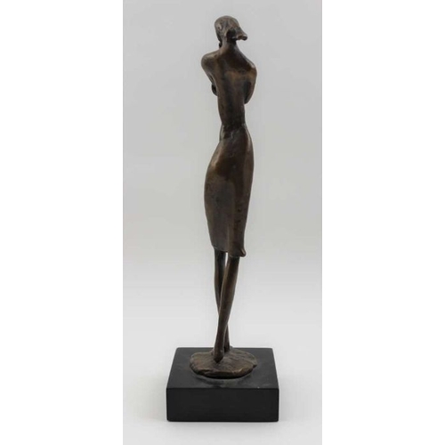 71 - A late 20th century bronze cast female figure, in a standing, contemplative pose, raised on black pl... 