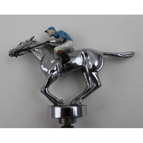 75 - A mid to late 20th century car mascot, chromed metal and painted as a cantering jockey, 8.5cm high