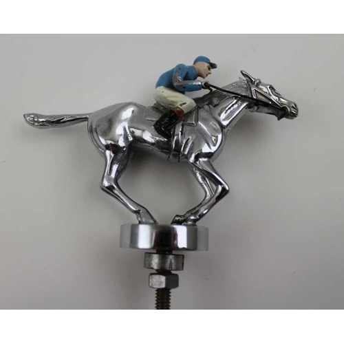 75 - A mid to late 20th century car mascot, chromed metal and painted as a cantering jockey, 8.5cm high