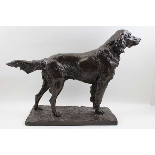 76 - A bronzed effect study of a retriever dog on ground work base, 34.5cm high