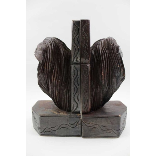 87 - A pair of carved wood bookends, lion mask decoration, 23cm high