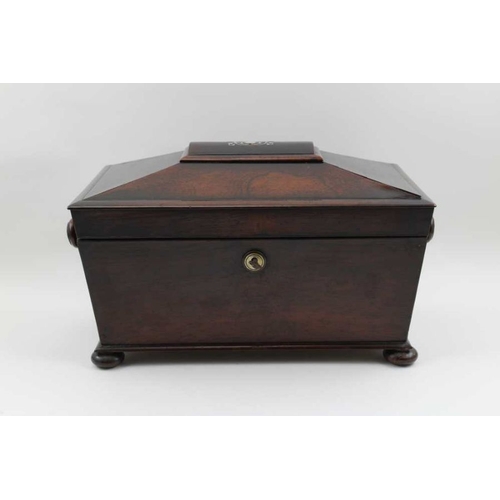 93 - A William IV rosewood double tea caddy of sarcophagus form, the hinged cover with mother-of-pearl in... 