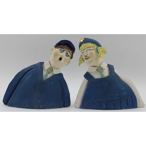 55 - A pair of Studio pottery figures, a school girl and boy, monogrammed