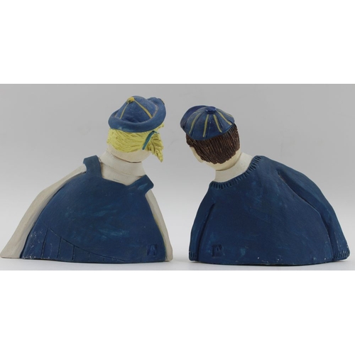 55 - A pair of Studio pottery figures, a school girl and boy, monogrammed