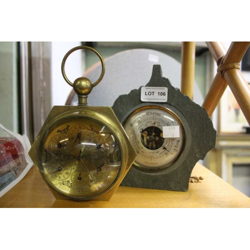 106 - A brass and glass domed lens desk clock, together with a slate cased barometer.