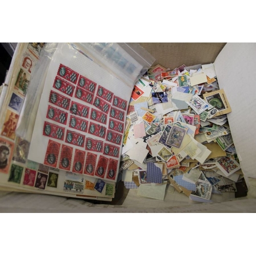 136 - A large quantity of lose stamps in a box