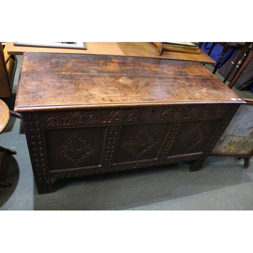 140 - An 18th century plan and panel coffer, with later carved front, the interior fitted with candle box,... 