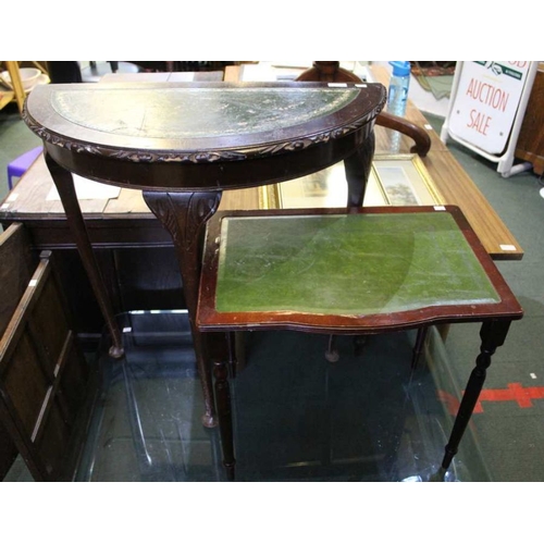 141 - Two green leather topped side tables.