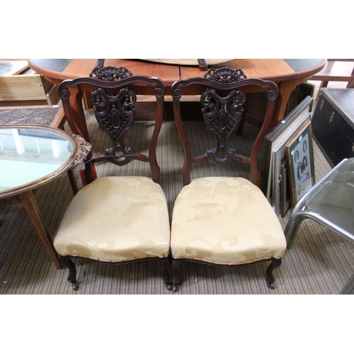 182 - A pair of first quarter 20th century fancy backed low seated chairs, probably from a salon suite