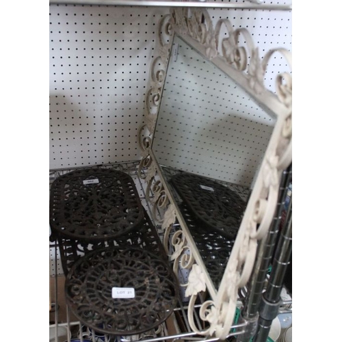 21 - Three cast iron pot stands, together with a rectangular white framed mirror