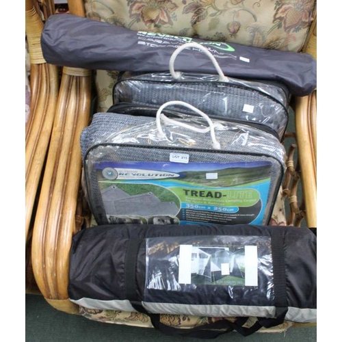 215 - Two camping carpets, an awning and an awning hanger, all in original carry cases