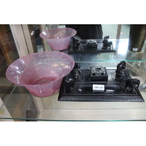 217 - A carved Indian ebony desk stand with a possible Scottish art glass vase.