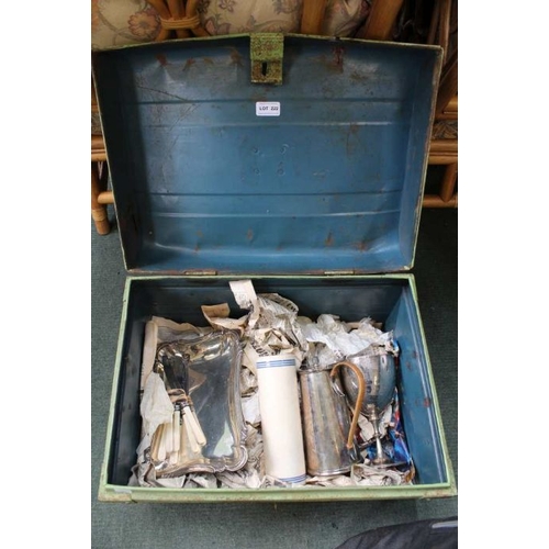 222 - A green tin trunk containing a selection of domestic items, to include coffee pot, trophy, etc.