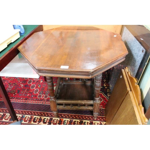 224 - A late 19th century walnut octagonal topped table, on ring turned legs, united by a galleried undert... 