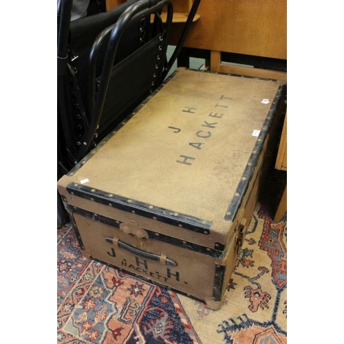 229 - A large tin trunk - J H Hacket inscribed to the lid and the sides.