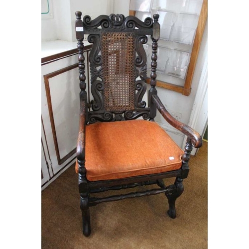 232 - A Carolean design open armchair, carved frame, with crown crest, scroll arms, cane seat and back