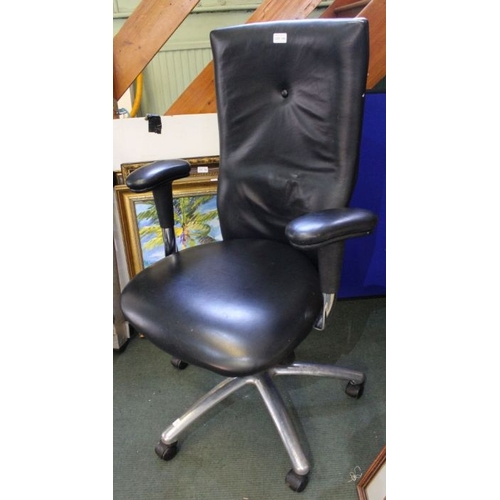 234 - A black leather upholstered high backed modern swivel office chair