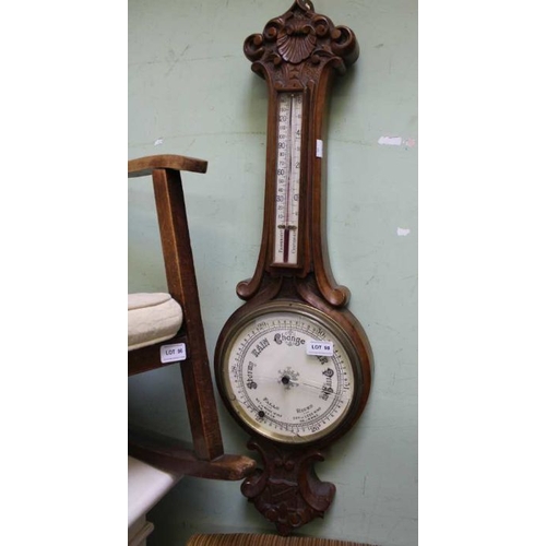 98 - A walnut carved barometer thermometer