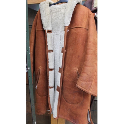 264 - Two gentleman's sheepskin jackets, both well used & one has tear to shoulder