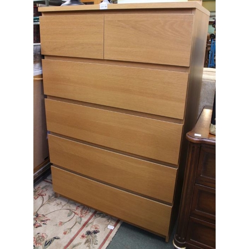 100 - A modern wood effect chest of two short over four long drawers.