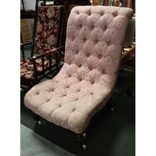 127 - An Edwardian nursing chair, turned fore supports, button pink upholstery.