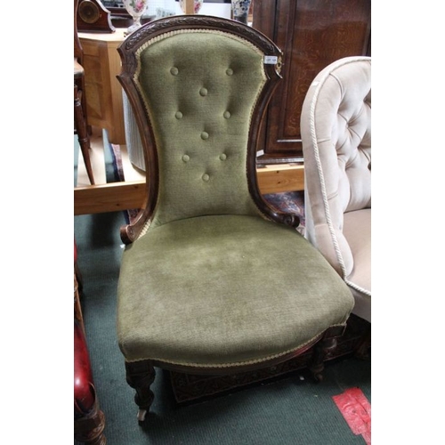 129 - A late Victorian nursing chair, green upholstered with button back.