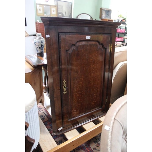 130 - An 18th century oak corner cupboard