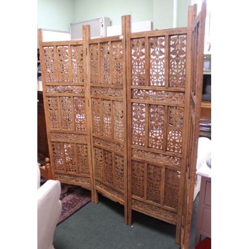 134 - A folding carved four panel wooden room screen, Size of one panel is 185cm x 51cm.