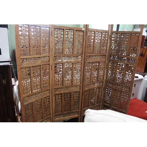 134 - A folding carved four panel wooden room screen, Size of one panel is 185cm x 51cm.