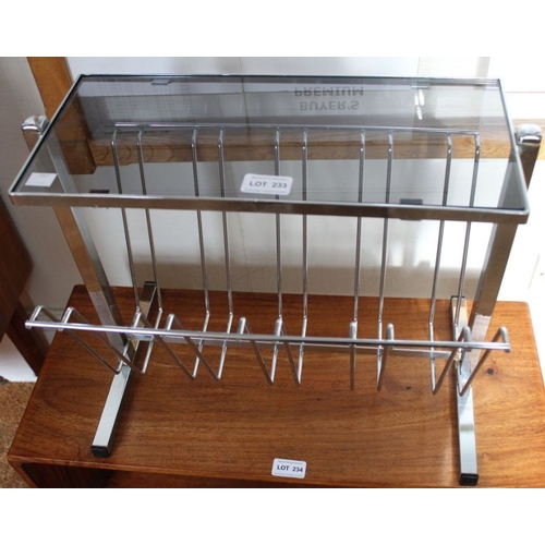 233 - A 1970's chromed magazine rack with smoked glass tabletop