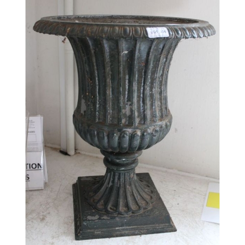 236 - A cast iron campagna form garden urn, remains of green painting, 50cm high