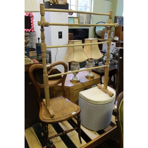 245 - A wooden clothes horse, bergere seated chair & a Lloyd Loom linen basket