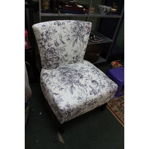 96 - A contemporary floral fabric upholstered chair.