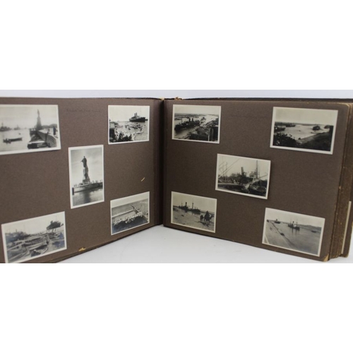 129 - A family photograph album recording a World Cruise 1927