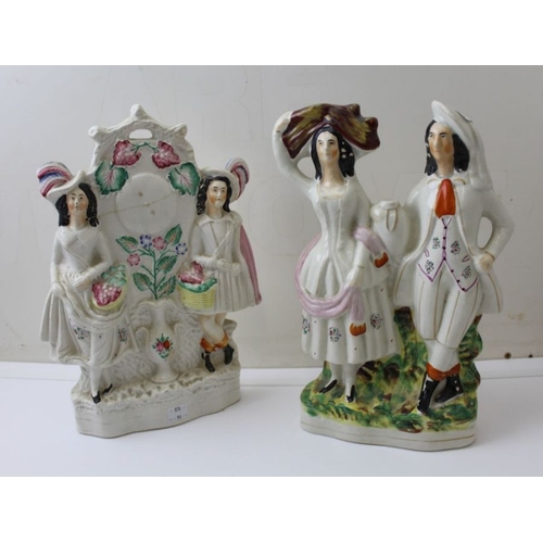 130 - Two large Staffordshire pottery figure groups, 32cm high