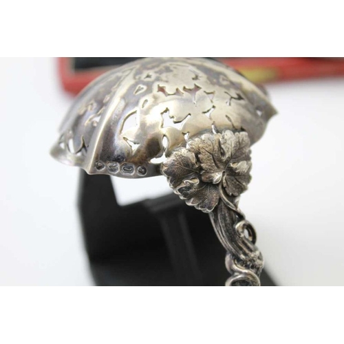 18 - Francis Higgins ll, a Victorian silver sifting ladle, fruiting vine cast handle, gilded bowl, London... 