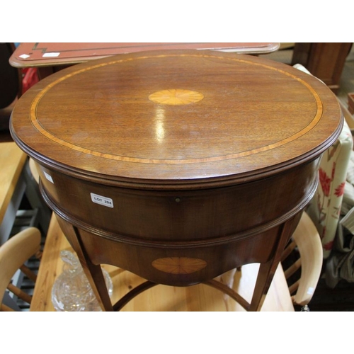 204 - A reproduction Regency style oval lift lid side table