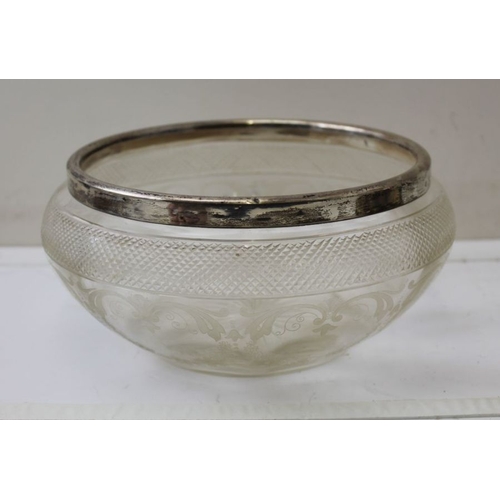 21 - A cut glass fruit bowl, with silver rim, 20cm in diameter, and a lemonade jug