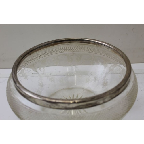 21 - A cut glass fruit bowl, with silver rim, 20cm in diameter, and a lemonade jug