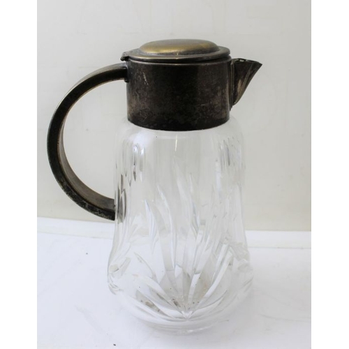 21 - A cut glass fruit bowl, with silver rim, 20cm in diameter, and a lemonade jug