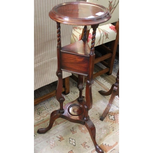 213 - A mahogany stand of Georgian design, circular top over small drawer tier