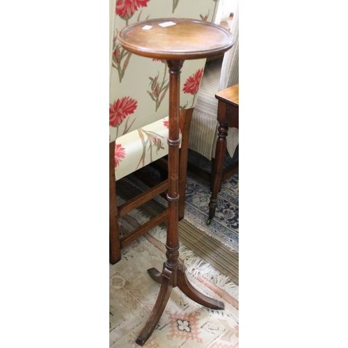 214 - A reproduction mahogany finished saucer topped torchere stand on three downswept reeded legs, 99cm h... 