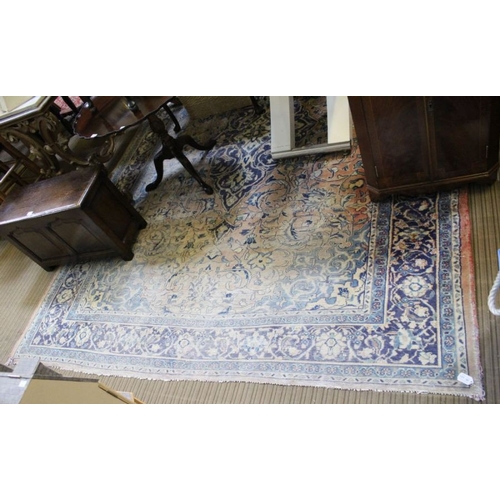 219 - A large Persian design carpet (sun damaged), 228cm x 302cm