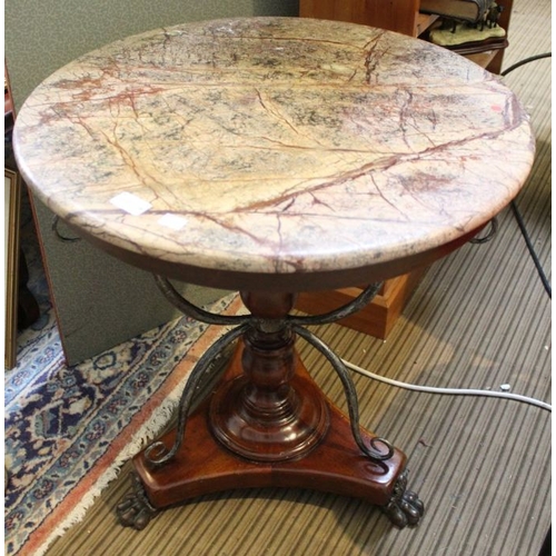 229 - A marble topped table with turned column & scrolling metal supports, with applied cast metal claw fe... 