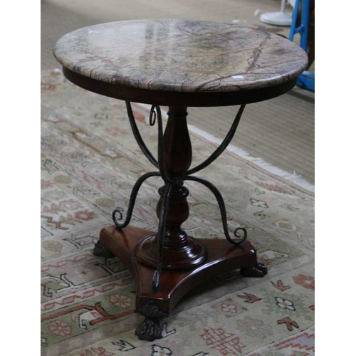 229 - A marble topped table with turned column & scrolling metal supports, with applied cast metal claw fe... 