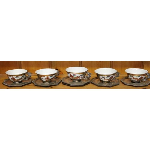 230 - Six Vietnam .900 silver saucers and five silver mounted china cups