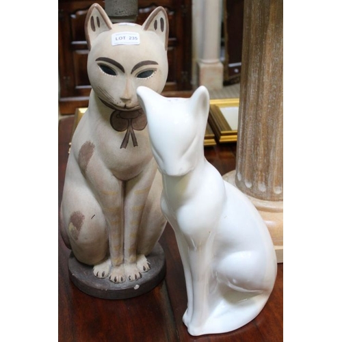 235 - A large plaster cat and a pottery cat modelled in the Art Deco taste