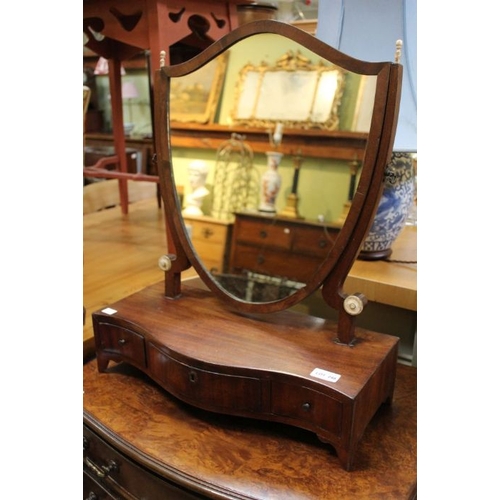 248 - A dressing table mirror mounted on a three draw platform.