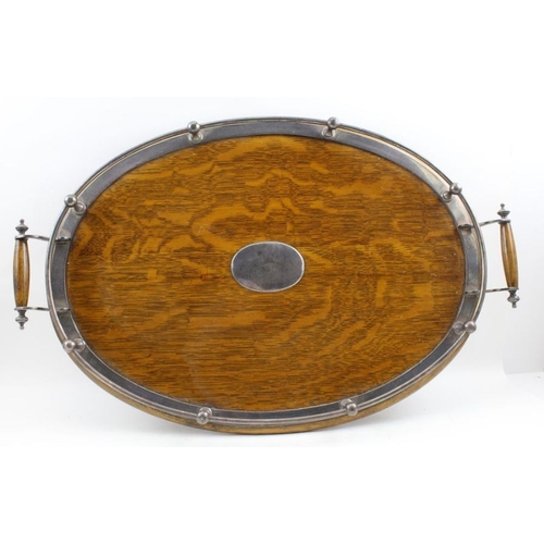 27 - An Edwardian oval oak tea tray with silver plated gallery, base 52cm x 32cm